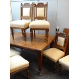 EDWARDIAN ARTS & CRAFTS-STYLE MAHOGANY EXTENDING DINING TABLE (with two extra leaves) and set of six