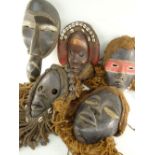 FIVE VARIOUS DAN MASKS some with fibre assemblages (5)