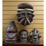 FOUR AFRICAN 'HELMET' MASKS including Wum mask, Mende bundu society mask, Makonde mask and Bete