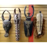 FOUR LARGE AFRICAN MASKS including crocodile mask, Fang ngil mask, Nafana bedu mask and another (4)