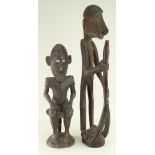 IATMUL SEATED ANCESTOR FIGURE, 50cms and standing Asmat figure, 67cms (2)