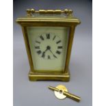 FRENCH BRASS CASED CARRIAGE CLOCK with key, 14cms H handle up