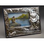 LARGE SILVER PHOTO FRAME showing 'Fisherman', embossed to front and velvet easel back, 1995