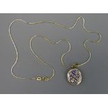 FOURTEEN CARAT GOLD FINE CHAIN with enamelled yellow metal locket, 4grms (chain only)
