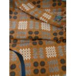 CLASSIC WELSH WOOLLEN BLANKET with 'Derw' label, traditional reverse pattern on a rust ground, 228 x