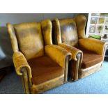 VINTAGE LEATHER WINGBACK ARMCHAIRS, a pair, with foldover arms and studded detail, 88cms H, 85cms W,