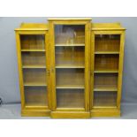 OAK THREE DOOR GLASS FRONTED BOOKCASES, a pair, stepped tops with shaped back rails, interior