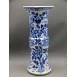 LARGE BLUE & WHITE ORIENTAL GU SHAPED VASE depicting two dragons on a floral background, 35cms H,