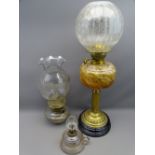 VICTORIAN OIL LAMP with mottled glass font and globular shade plus two other smaller