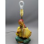 RARE BOSSONS CHALKWARE LAMP BASE of a gypsy figure playing an accordion, 33.5cms H including