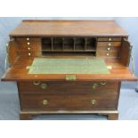 CIRCA 1840 MAHOGANY SECRETAIRE CHEST having ring pull brassware to a drop down dummy drawer front