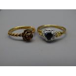 TWO NINE CARAT GOLD RINGS, one of sapphire and diamonds heart shape, the other of ruby flower form