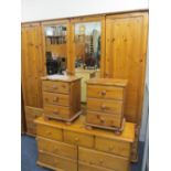 MODERN PINE BEDROOM SUITE of four door wardrobe, 198cms H, 200cms W, 58cms D with twelve drawer base