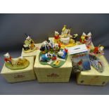 SIX RUPERT THE BEAR COLLECTABLE FIGURINES by Royal Doulton along with a Wedgwood pottery moneybox