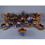 COPPER LUSTRE - a parcel of seven large and six smaller jugs and one bowl