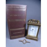 MATTHEW NORMAN BRASS ENCASED CARRIAGE CLOCK of fine quality with Corinthian corner columns, swing