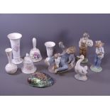 FOUR NAO PORCELAIN FIGURINES with a small selection of porcelain vases and bells, makers include