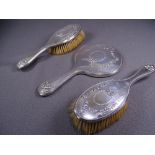 THREE PIECE SILVER BACKED DRESSING TABLE SET, each piece of attractive floral garlands (silvering to