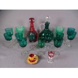DECORATIVE GLASSWARE - a good dark green glass decanter with plain handle and stopper together