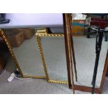 TWO GILT FRAMED WALL MIRRORS, a wood framed wall mirror and two walking sticks