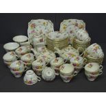 NEW CHELSEA STAFFORDSHIRE CHINA TEAWARE, white ground with floral decoration - a large parcel