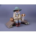 LLADRO PORCELAIN, large figural group of a young boy and dog on a bridge, numbered to the base '