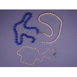 THREE CULTURED PEARLS & LAPIS LAZULI NECKLACES including a 47cms L near uniform strand of cultured