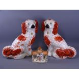 RED & WHITE STAFFORDSHIRE SEATED SPANIELS, a pair, 31cms H and a pottery pastille burner