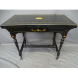 AESTHETIC STYLE EBONIZED & INLAID MAHOGANY CARD TABLE, the castors stamped 'C & C Patent', 74cms