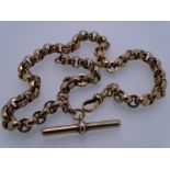 10CT GOLD MUFF CHAIN having large round moon and star pattern links and T-bar, 35grms