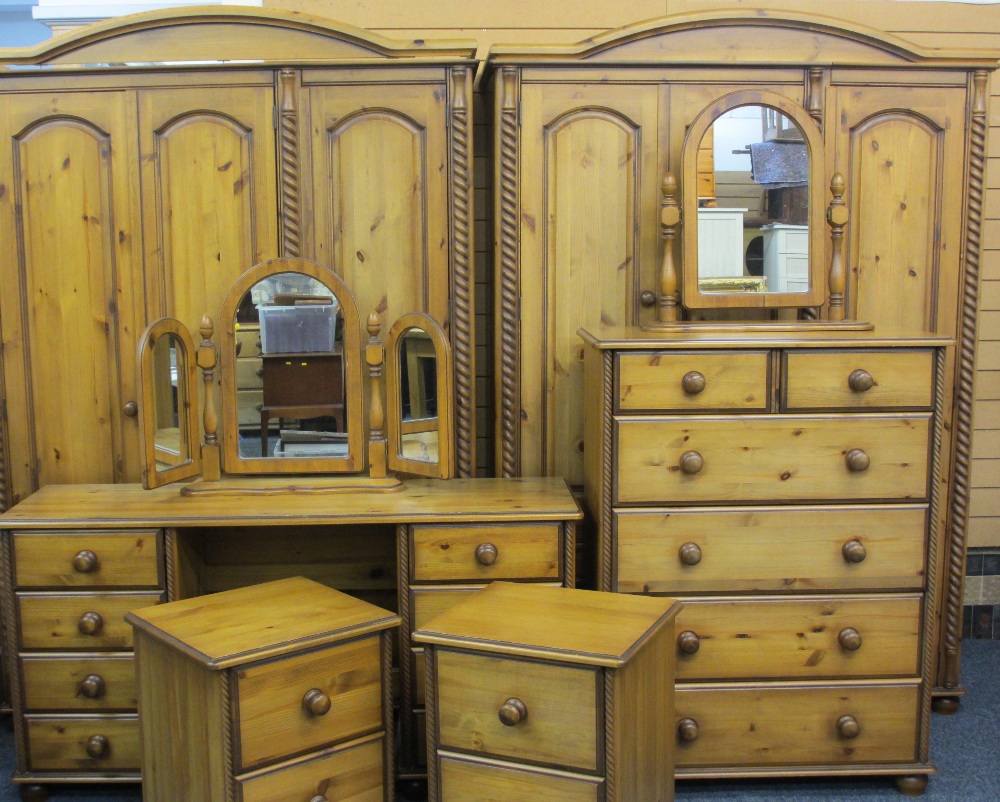 ATTRACTIVE REPRODUCTION PINE EIGHT PIECE BEDROOM SUITE comprising a three door wardrobe, a three