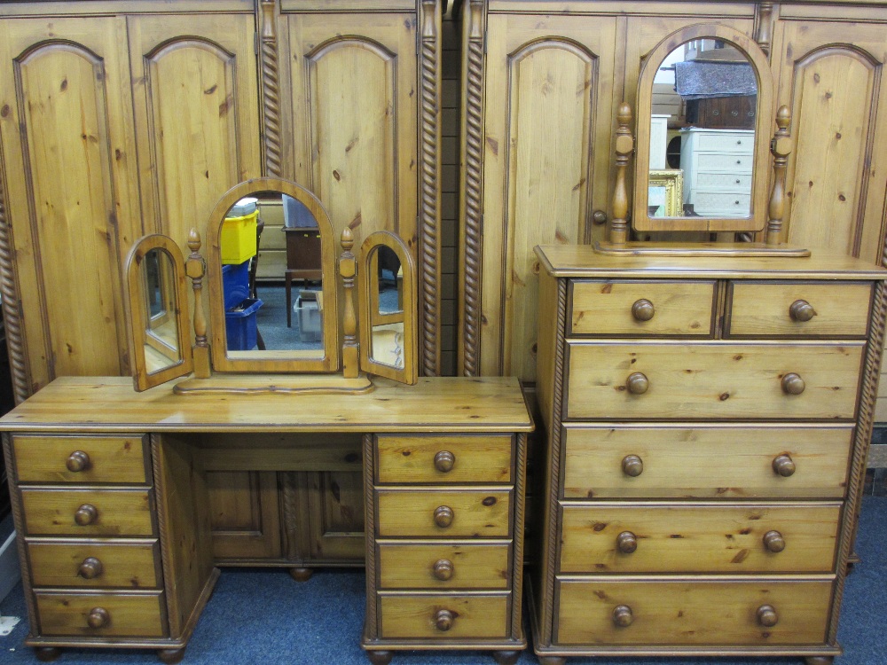 ATTRACTIVE REPRODUCTION PINE EIGHT PIECE BEDROOM SUITE comprising a three door wardrobe, a three - Image 2 of 2