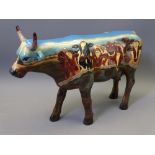 LARGE COW PARADE POTTERY FIGURINE decorated with cows looking over a wall, 20cms max H, 30cms L