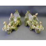 PAIR OF CONTINENTAL FLOWER HOLDERS, style of Royal Dux, each in the form of a four wheeled chariot