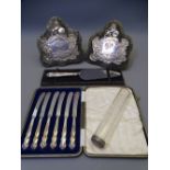 TWO SILVER FRONTED PRESENTATION SHIELDS, a cased set of silver handled butter knives, cake slice and