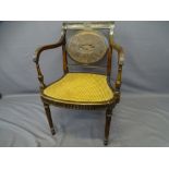 REGENCY MAHOGANY BERGERE ARMCHAIR with oval panel and carved detail to the back, 83cms H, 58cms W,