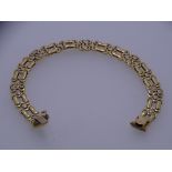 A 9CT GOLD DOUBLE PANTHER LINK FANCY BRACELET, 18.7grms