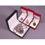 FOUR VINTAGE NECKLACES in presentation boxes to include a heart form pendant with cased green