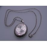 AN OVAL BRIGHT CUT SILVER LOCKET & CHAIN, 19grms