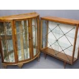 TWO VINTAGE CHINA DISPLAY CABINETS including a walnut example with shaped front and two sliding