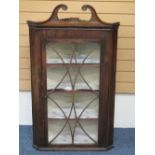 GEORGIAN MAHOGANY GLASS FRONTED WALL HANGING CORNER CUPBOARD with broken swan neck pediment top,