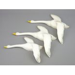 THREE POTTERY SWAN WALL ORNAMENTS, possibly Burslem pottery (neck damage to one)