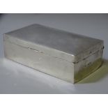 AN OBLONG WOODEN CIGARETTE BOX, silver mounted throughout, Birmingham 1911 by H W Williamson