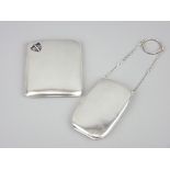 TWO CIGARETTE CASES including a curved pocket shape example with enamelled shield inset,