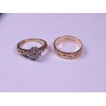 TWO 9CT GOLD RINGS including a raised form diamond set cluster with twist shoulders, mid K-L and a