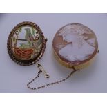 A 9CT GOLD OVAL CAMEO BROOCH, 4.7 x 3.7cms and a yellow metal oval Jadeite style brooch featuring