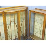 TWO VINTAGE CHINA DISPLAY CABINETS including a 1920s walnut example with shaped front doors,