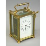 FRENCH BRASS CASED CARRIAGE CLOCK retailed by Finnegans Ltd, Manchester and Liverpool, bevelled edge