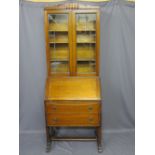 ART DECO OAK BUREAU BOOKCASE with leaded glass doors to the upper section on an unusual bureau base,