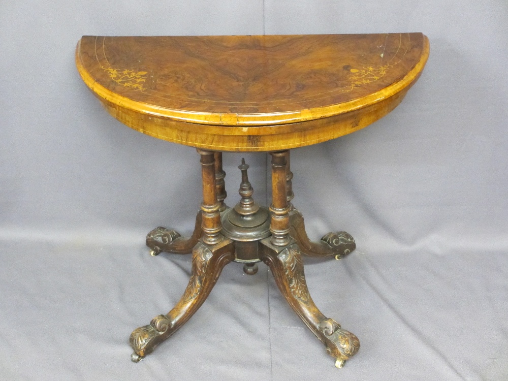 VICTORIAN INLAID WALNUT FOLD-OVER CARD TABLE on an open four column base and carved splayed feet